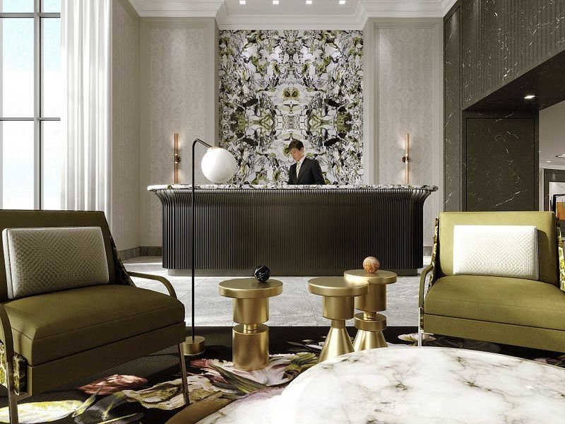 This is 259 The Kingsway, A Tridel building, luxury condo. Hotel lobby with a front desk, green armchairs, gold tables, and a decorative wall art behind the reception desk. 
